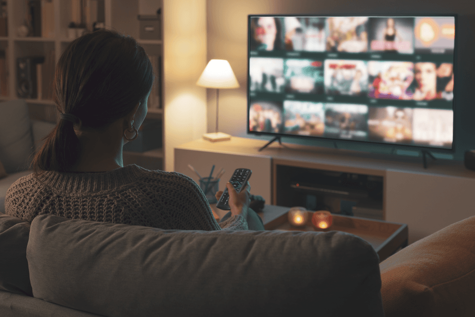 lady watching streaming service on home television