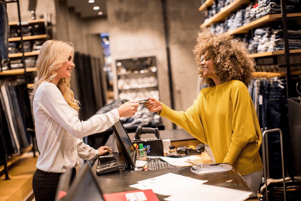 lady making a purchase at a retail store